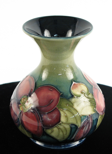 Appraisal: AN ENGLISH MOORCROFT POTTERY VASE Clematis pattern on green ground