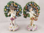 Appraisal: A pair of ceramic figures of amorini one playing a