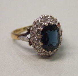 Appraisal: An ct gold sapphire and diamond set oval cluster ring