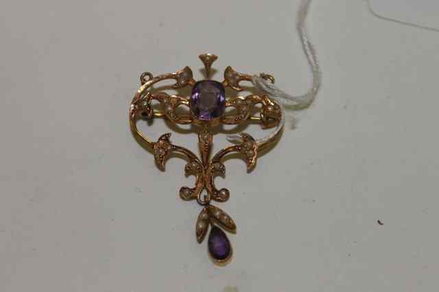 Appraisal: A VICTORIAN CT GOLD PENDANT with stylised amethyst and pearl