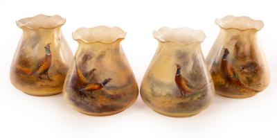 Appraisal: Four Royal Worcester small tapering vases with gilt edged flared