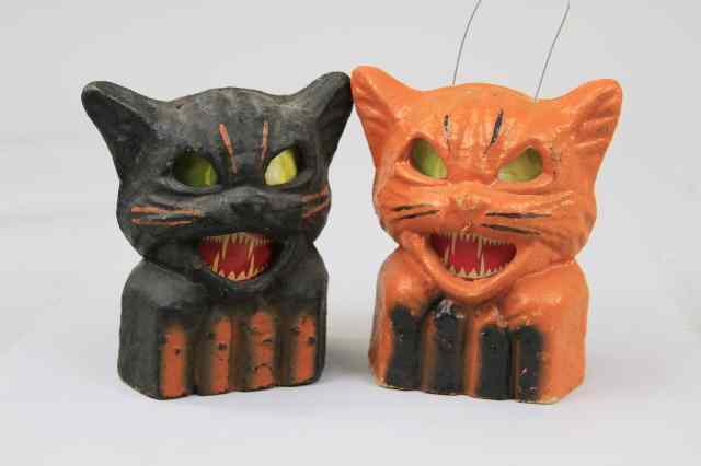 Appraisal: TWO CATS ON FENCE HALLOWEEN LANTERNS USA pulp cat on