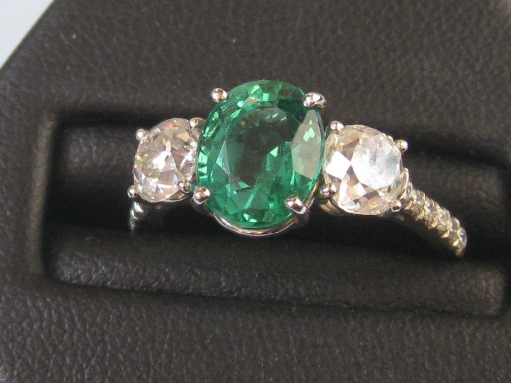 Appraisal: An Emerald and Diamond Ring the oval shaped emerald approx