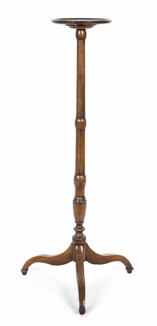 Appraisal: A Continental Mahogany Candlestand having a circular top over the