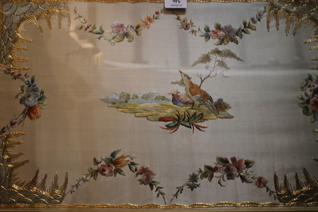 Appraisal: AN EMBROIDERED SILK PANEL set into a mahogany tray with