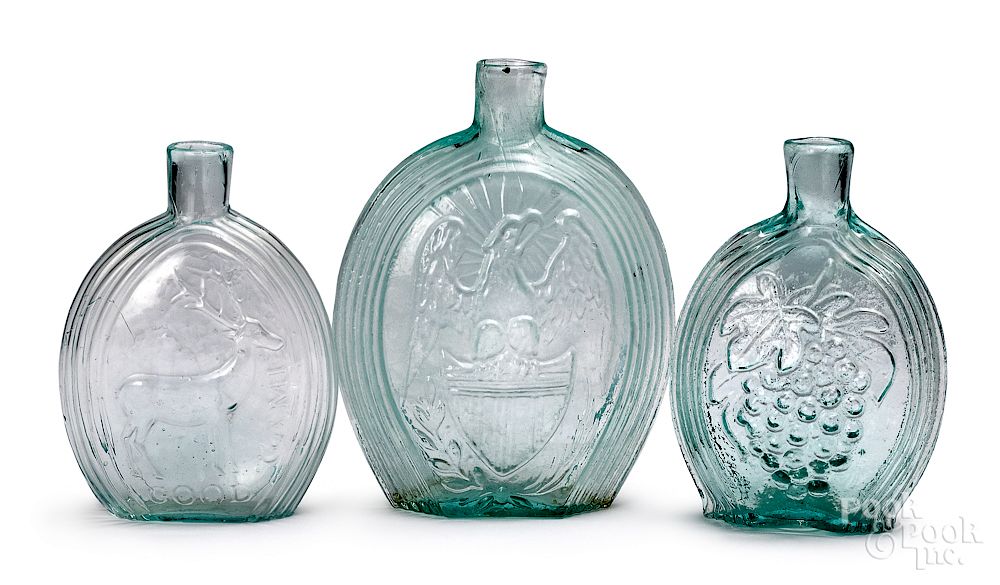 Appraisal: Three pale aqua historical glass flasks Three pale aqua historical