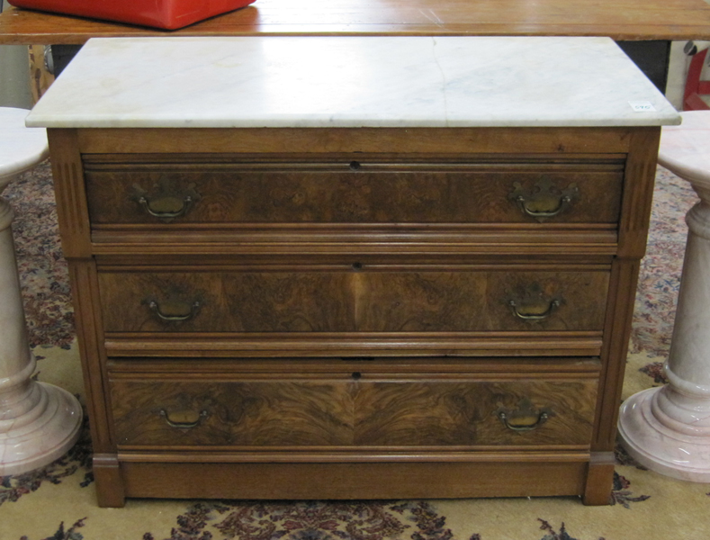 Appraisal: A VICTORIAN MARBLE-TOP WALNUT DRESSER the rectangular white marble top