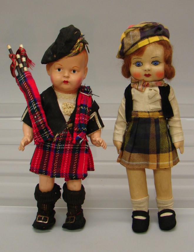 Appraisal: Pair of unmarked dolls in original clothing Compo Scottish boy