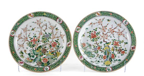 Appraisal: Pair Chinese famille vert chargers lattice-decorated rim centering scene of