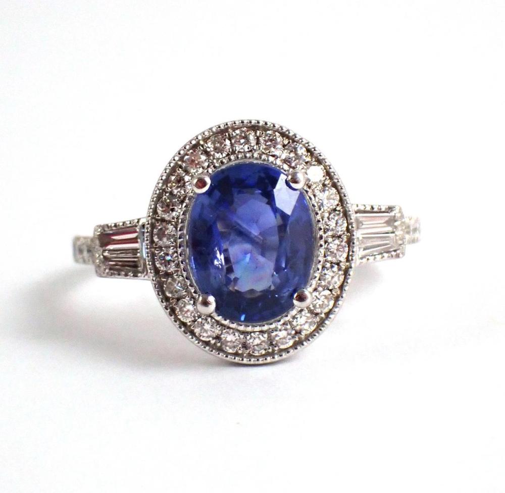 Appraisal: SAPPHIRE DIAMOND AND PLATINUM RING with round and baguette diamonds