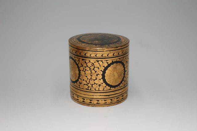 Appraisal: A Burmese lacquer box gold on black one inset compartment