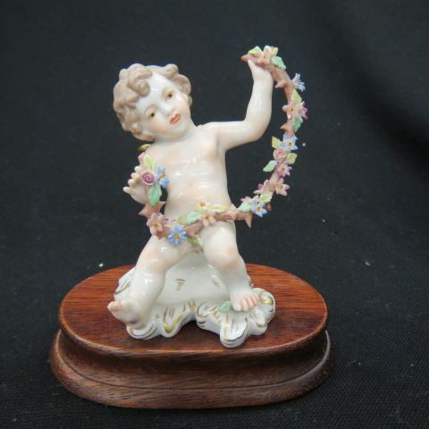 Appraisal: Fine Dresden Porcelain Figurine of a Cherub with garland