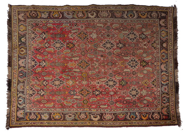 Appraisal: A PERSIAN SHIRAZ SMALL CARPET with herati rose red field