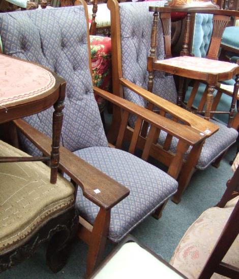 Appraisal: A pair of oak 'Liberty' style armchairs in the Arts