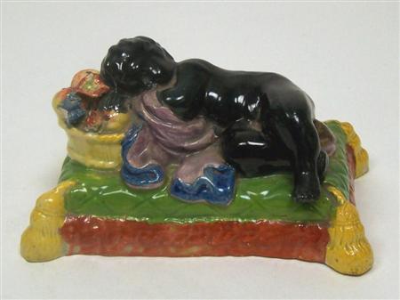 Appraisal: An early th century Staffordshire figure of a sleeping black