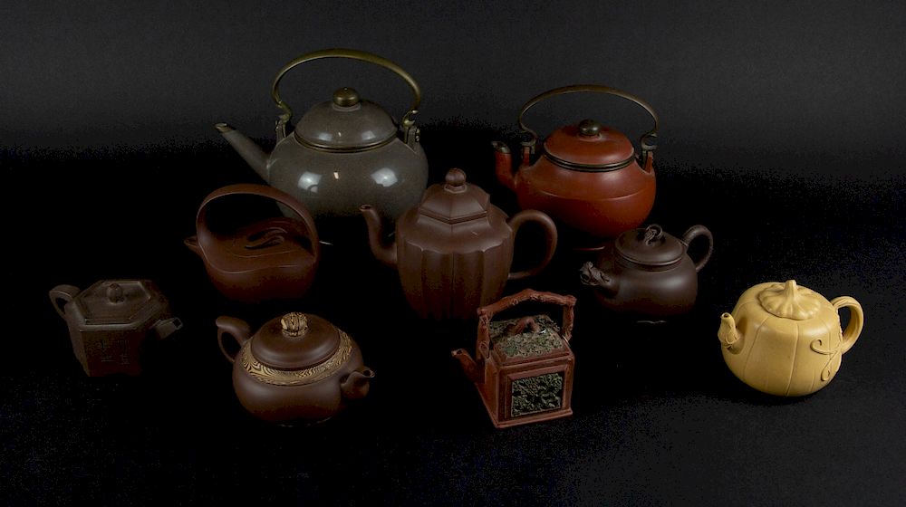 Appraisal: A Group of Yixing Teapots Chinese One pot made for