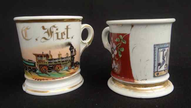 Appraisal: Lot two painted occupational shaving mugs including train chipped and