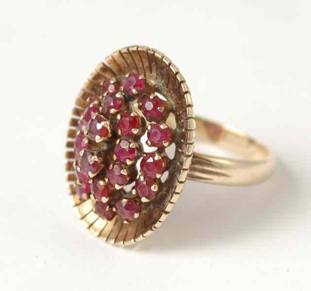 Appraisal: RUBY AND FOURTEEN KARAT GOLD CLUSTER RING set with round-cut