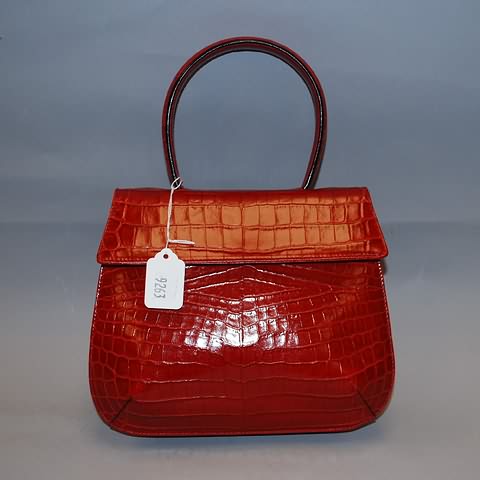 Appraisal: Salvatore Ferragamo red leather handbag stamped with alligator pattern front