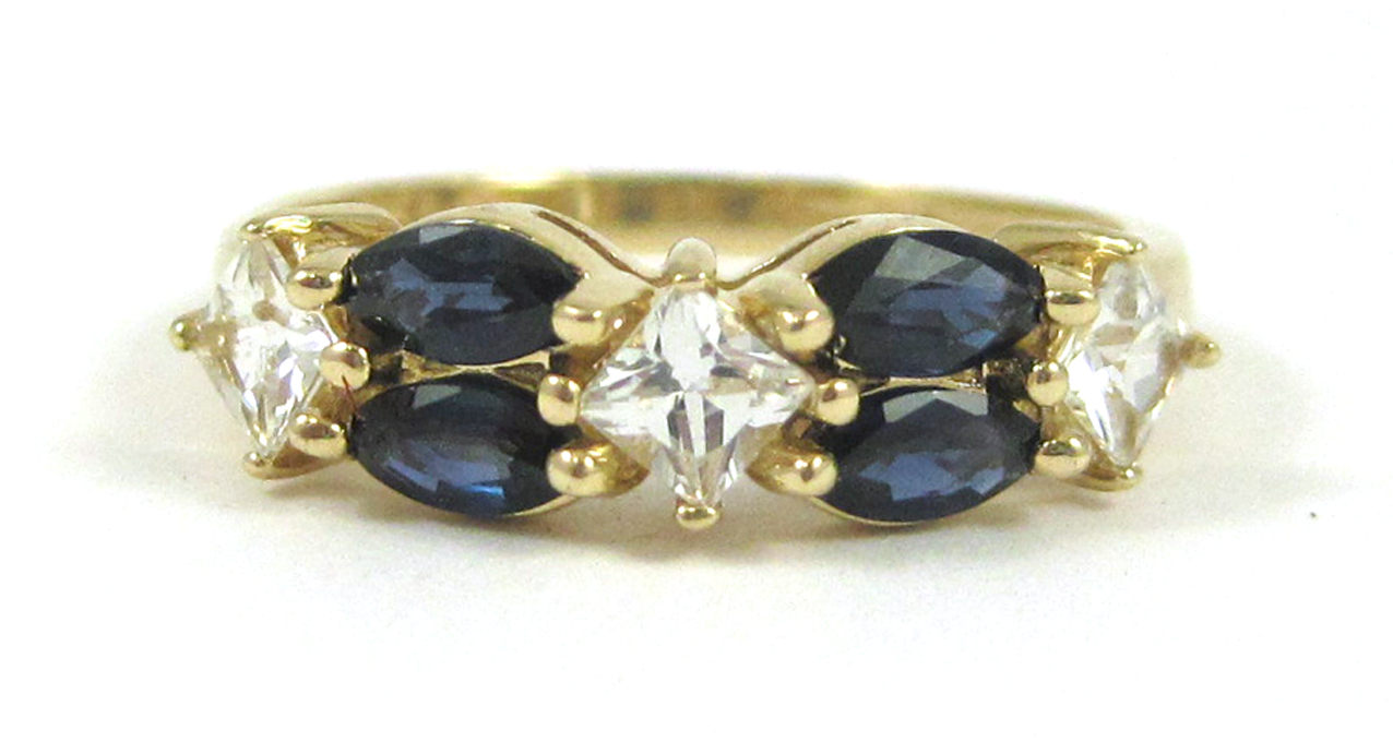 Appraisal: SAPPHIRE AND FOURTEEN KARAT GOLD RING set with four marquise-cut