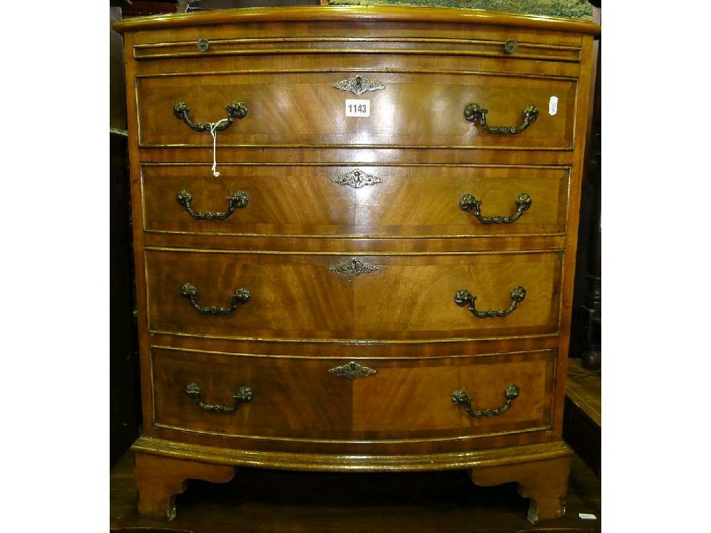 Appraisal: A reproduction Georgian style mahogany bow fronted batchelor's chest fitted