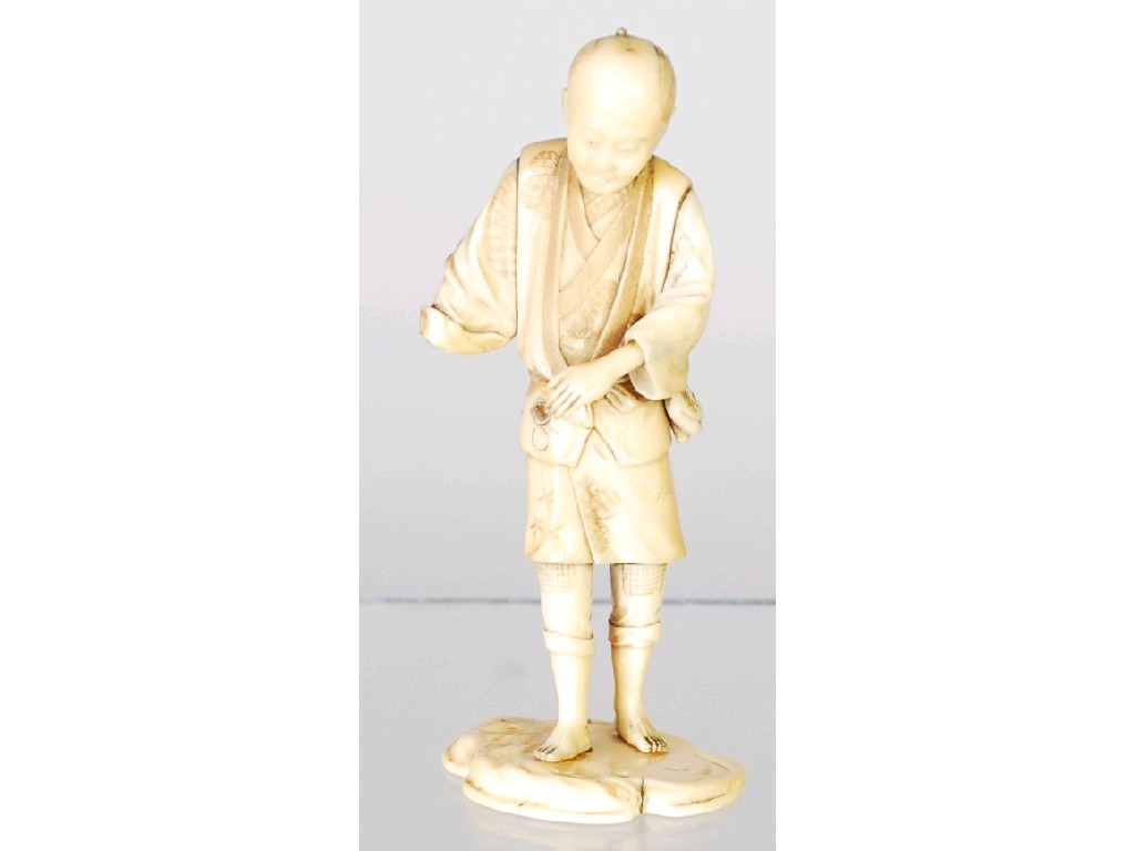 Appraisal: ORIENTAL CARVED SECTIONAL IVORY FIGURE of a man wearing a