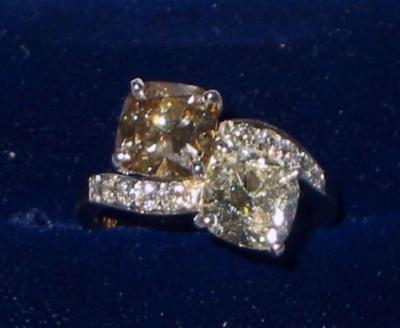 Appraisal: A TWO STONE DIAMOND RING of crossover form comprising a