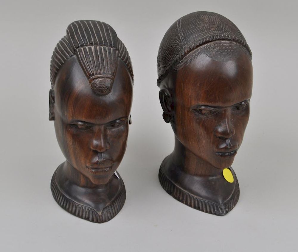 Appraisal: Pair African Carved Hardwood Busts depicting a couple Largest high