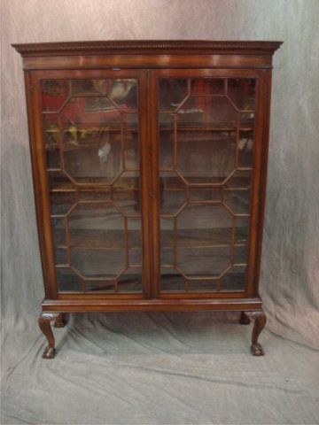 Appraisal: th cent door mahogany bookcase raised on ball and claw