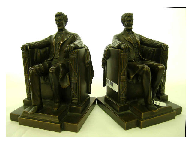 Appraisal: Pair of bronzed bookends signed DC French JB depicting seated