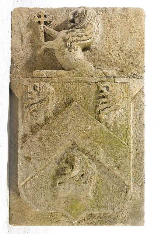 Appraisal: HERALDRY AN ENGLISH CARVED LIMESTONE BLOCK carved in high relief