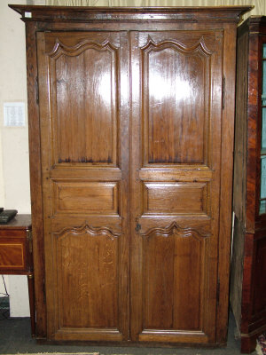 Appraisal: A French oak armoire th century the moulded cornice above