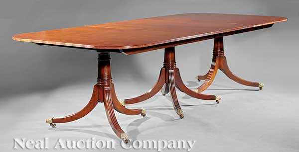 Appraisal: A Georgian-Style Carved Mahogany Three Pedestal Dining Table top with