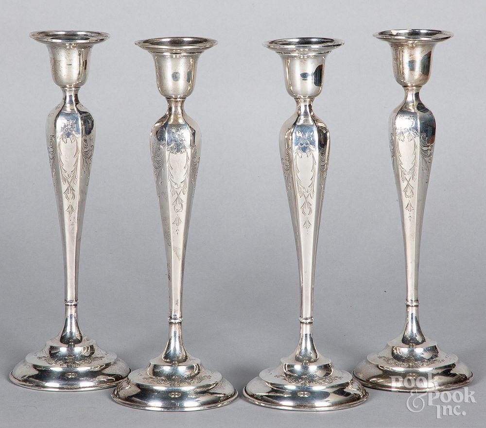 Appraisal: Set of four sterling silver weighted candlesticks Set of four