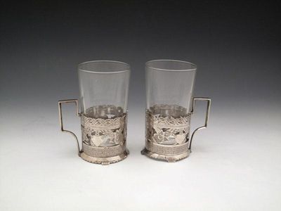 Appraisal: A pair of metal ware tea glass holders probably Egyptian