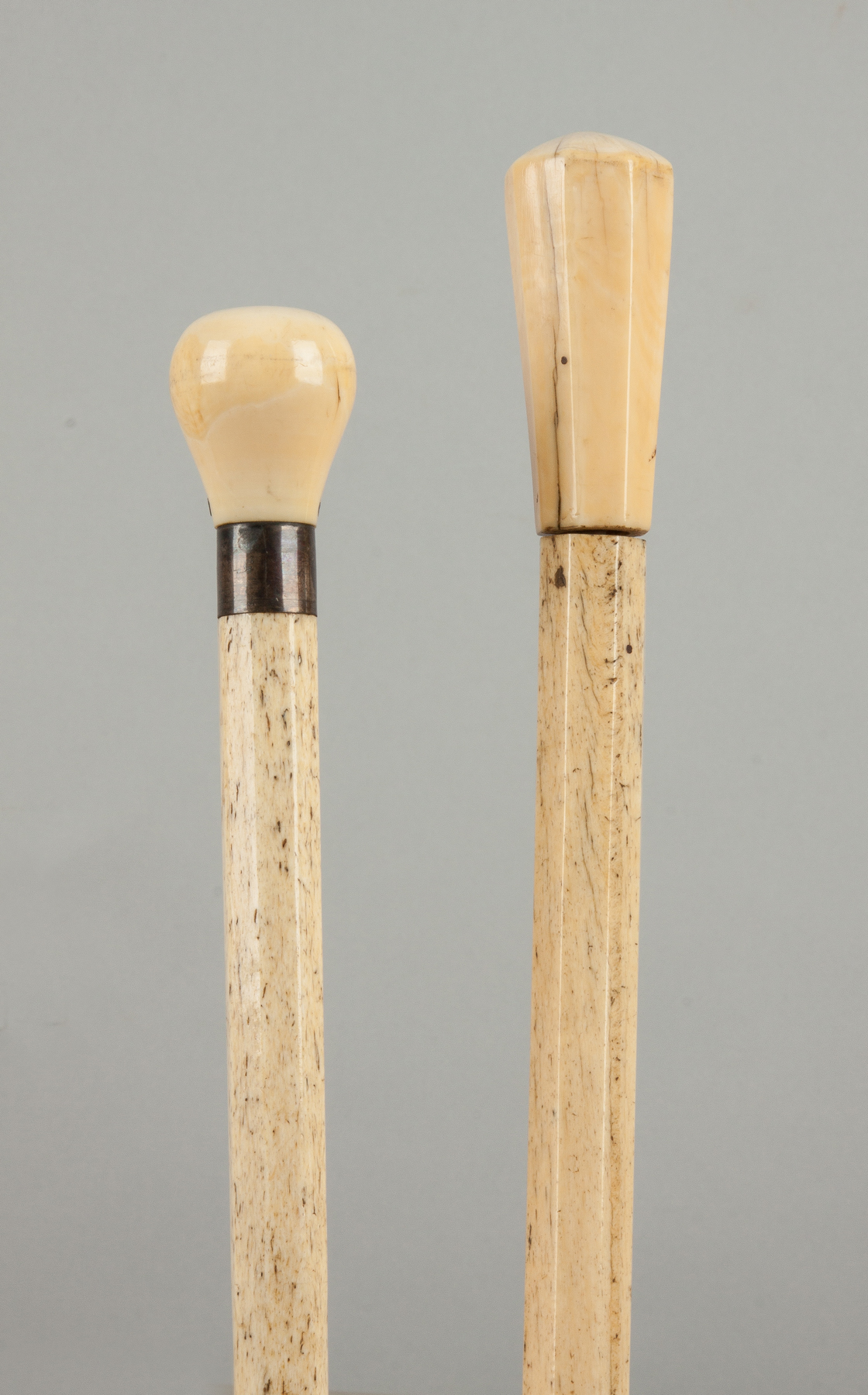 Appraisal: Two Fluted Canes with Carved Handles Late th early th