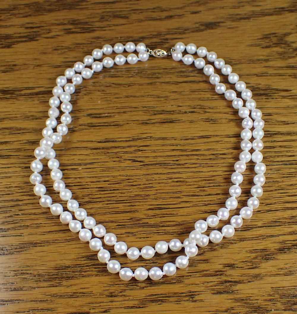 Appraisal: DOUBLE STRAND PEARL AND FOURTEEN KARAT GOLD NECKLACE - hand-knotted