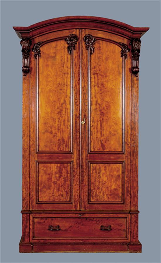 Appraisal: Irish carved mahogany linen press circa molded elliptical cornice supported