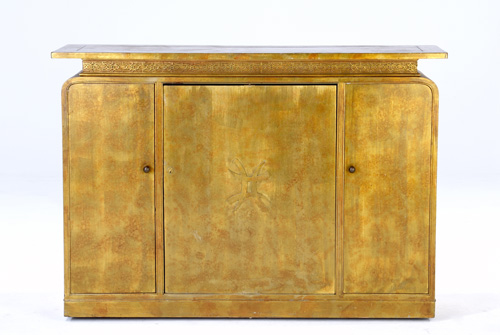 Appraisal: JAMES MONT Three-door bar cabinet with carved Asian motif and