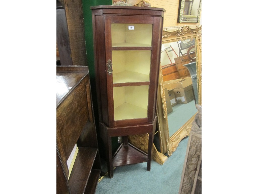 Appraisal: Glazed corner cabinet on stand