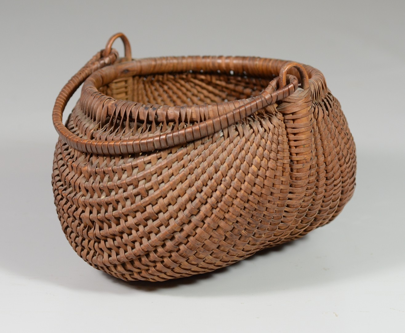 Appraisal: Buttocks Wrapped Basket with Wing Handle l w h RCA