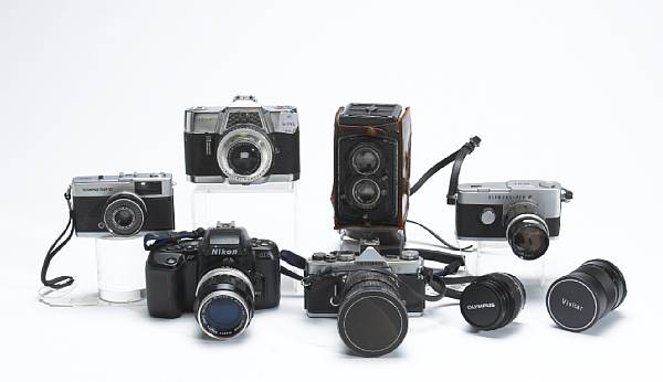 Appraisal: A group of cameras and lenses Including makers Nikon Agfa