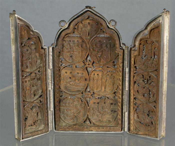 Appraisal: Continental silver-tone Filigree triptych encasing three finely carved wood panels