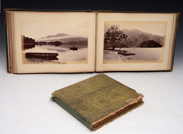 Appraisal: A PHOTOGRAPH ALBUM comprising views of Wales Scotland etc plus