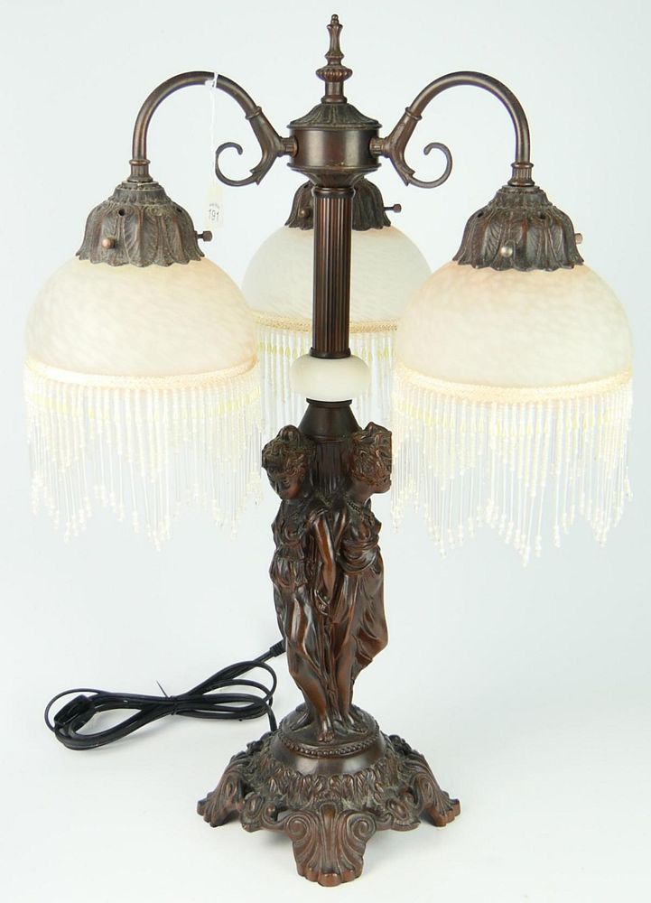 Appraisal: DECO STYLE LAMP WITH SATIN SHADES Features a deco lady