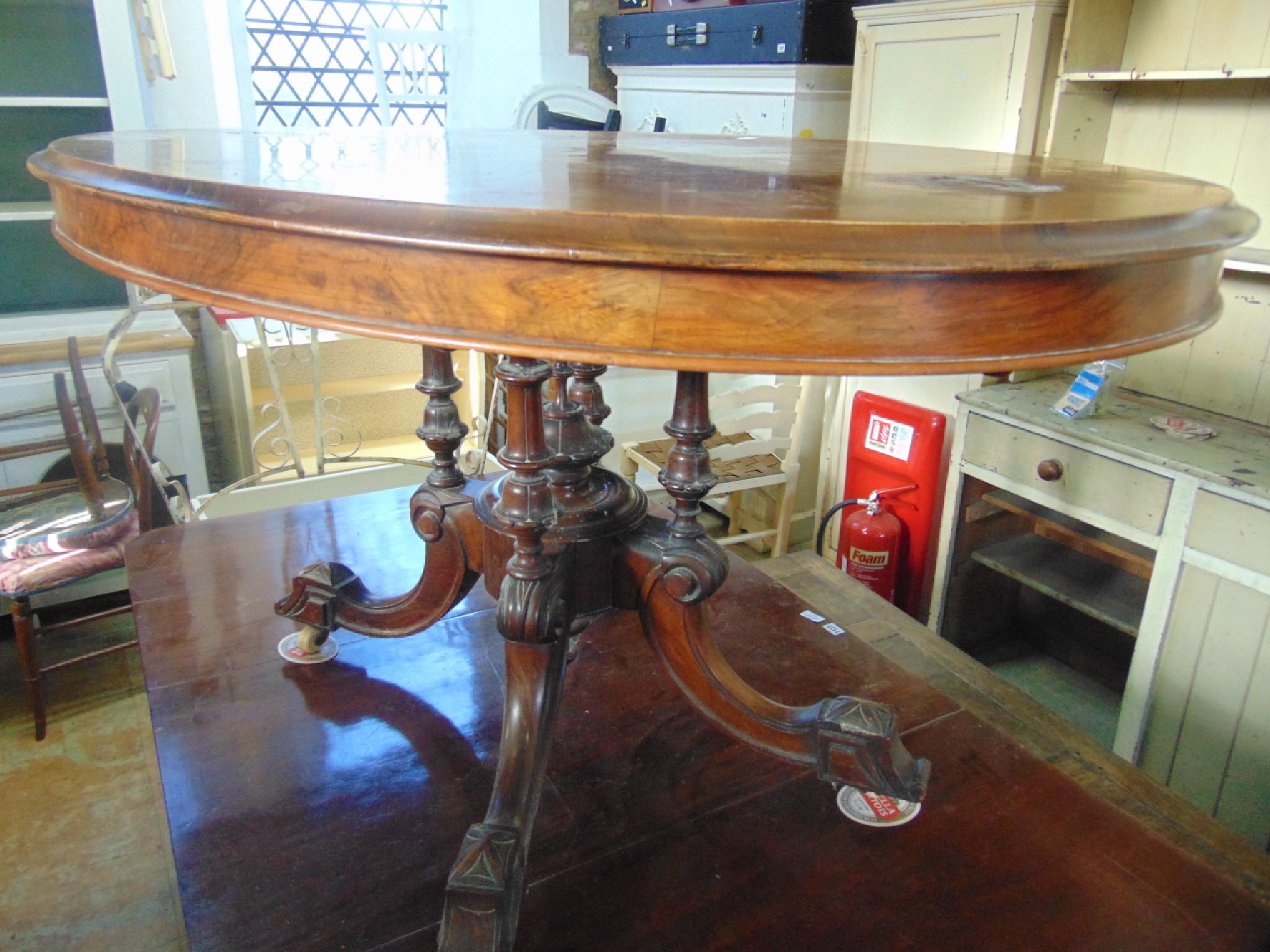 Appraisal: A Victorian walnut and figured walnut veneered tilt top breakfast