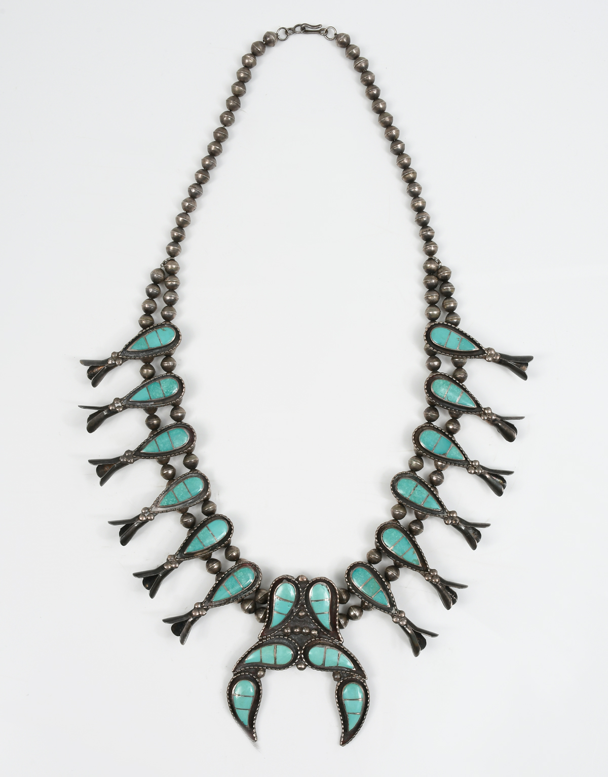 Appraisal: NATIVE AMERICAN TURQUOISE STERLING SQUASH BLOSSOM NECKLACE Beautifully crafted sterling