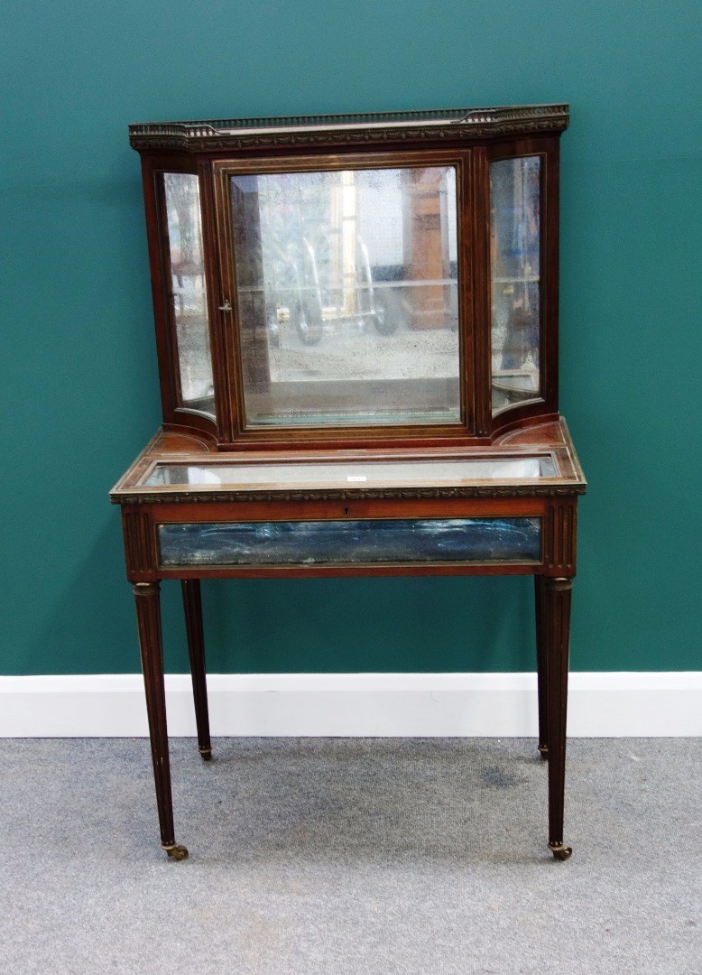 Appraisal: A late th century French brass inlaid mahogany display cabinet