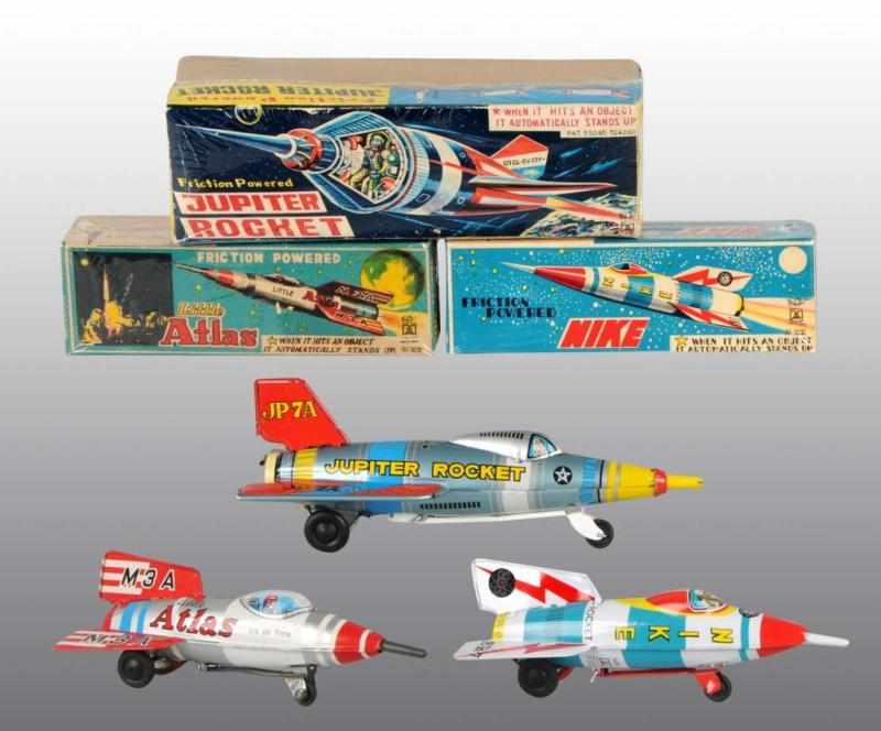 Appraisal: Lot of Tin Space Rocket Friction Toys Description Japanese Working