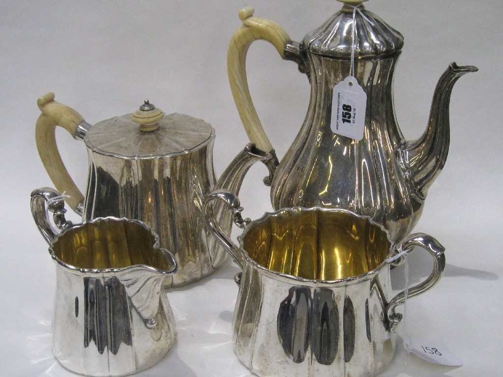 Appraisal: Victorian silver four piece tea service with ivory handles by